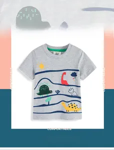 Macro shot of colorful dinosaur print on gray cotton fabric and neckline detail for kids' T-shirt