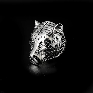 Macro view of the detailed silver-toned stainless steel tiger head ring for men fashion
