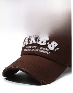 Detail of dark brown vintage baseball cap with white ARIES embroidery and distressed holes
