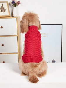 Detail of red pet knit sweater featuring high collar and textured checkered pattern