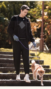 Men's outdoor winter thermal gloves shown in a stylish autumn park casual lifestyle scene