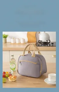 Large capacity grey insulated lunch bag showing storage for two lunch boxes and drinks