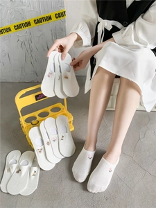 Detailed view of white cotton invisible socks with cute animal and flower embroidery