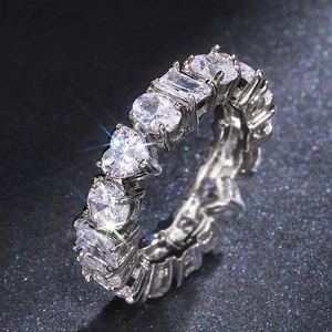 Silver eternity ring with multi-shape heart and rectangle zirconia on black background