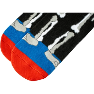 Detailed close-up of the cotton knit texture and skull pattern on the sock toe area