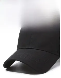 Close-up of a black baseball cap featuring a reinforced curved brim with parallel stitching