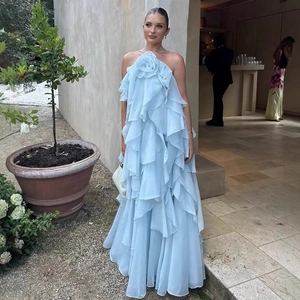 Light blue tiered ruffle maxi dress with 3D flower neck detail and halter back style