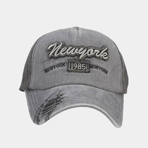 Detail of washed grey baseball cap with Newyork 1985 embroidery and shark print