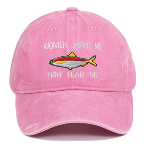 Close-up of pink washed cotton baseball cap with Fish Fear Me embroidery and texture