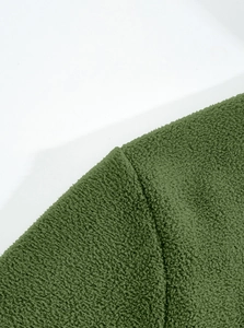 Close-up detail of soft dark green fleece fabric texture on tactical outdoor jacket