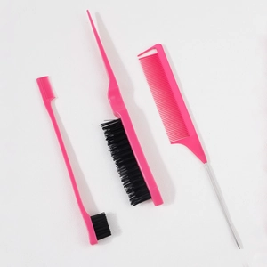 Macro detail of 3-piece pink hairstyling set including edge brush and steel tail comb
