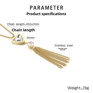 Macro detail of long tassel pendant with 24mm triangular crystal on gold steel chain
