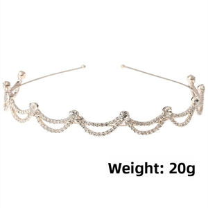Detail of 20g champagne gold wavy headband featuring white rhinestones and pearls