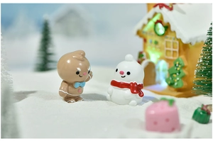 Close-up of miniature gingerbread man and snowman figurines for Christmas DIY decor