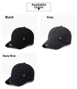 Close-up of warm winter baseball caps in black, gray, and navy blue with fleece lining