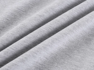 Macro shot of soft grey knit fabric texture showing high-quality fiber weaving details