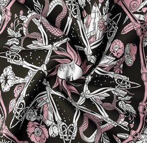 Macro detail of gothic mushroom tapestry fabric showing snake and skull print textures