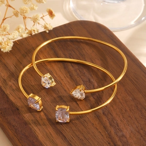 Golden stainless steel heart and square zircon open cuff bracelets set on wood