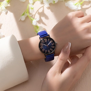 Detailed shot of a ladies' quartz watch with blue dial and rose gold numerals on the wrist