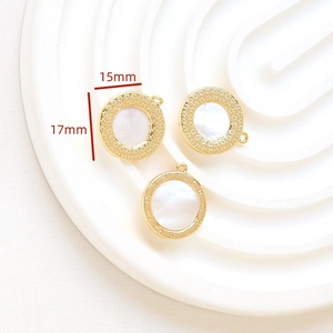 Macro view of shell inlay gold pendants with 15mm and 17mm size specifications