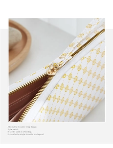 Detailed macro view of the gold metal zipper and textured leather on this women's wallet