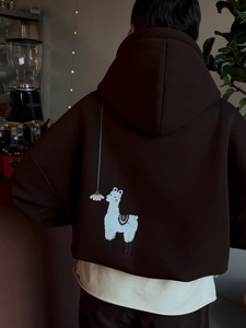 Dark brown oversized hoodie featuring a white alpaca graphic print on the back