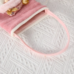Pink plush Christmas gift bag with sequins and handle for holiday treats and decoration