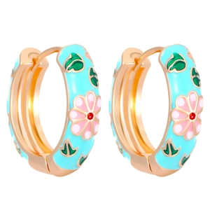 Detail of light blue enamel hoop earrings with pink flowers and gold metal finish