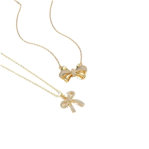 Minimalist gold bow pendant necklaces with sparkling crystals on a delicate chain