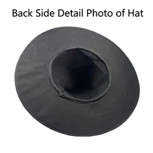 Back view detail of a pleated black velvet witch hat showing inner lining and texture