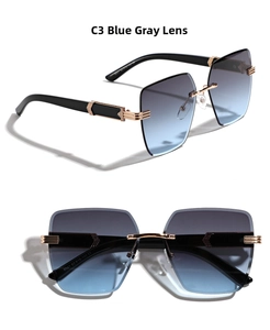 Detail of rimless rectangle sunglasses with blue-grey gradient lenses and gold accents