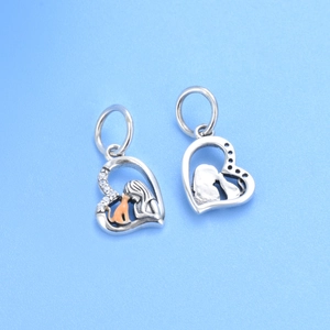 925 sterling silver heart charm with girl and cat design and orange enamel detail