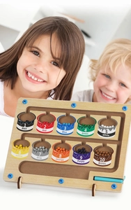 Children playing with magnetic wooden color sorting and counting maze toy board