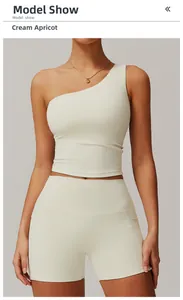 Detailed view of women's one-shoulder yoga vest and high-waist shorts in creamy apricot