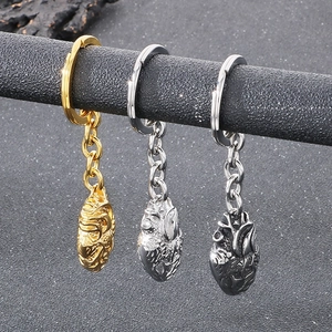 Polished metal anatomical heart keychains in gold, silver, and gunmetal finishes