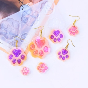 DIY silicone molds for cat paw earrings and glittery heart-shaped epoxy resin pendants