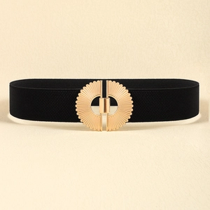 Detail of black elastic belt featuring an ornate gold alloy interlocking buckle