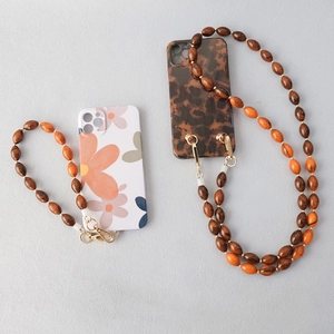 Lanière de téléphone polyvalente en perles orange et marron avec fermoirs dorés