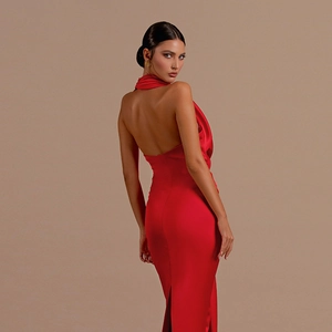 Detailed back view of sleek red satin halter dress with an elegant backless design