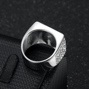 Luxury men's signet ring in silver stainless steel with side paved zircons on black background