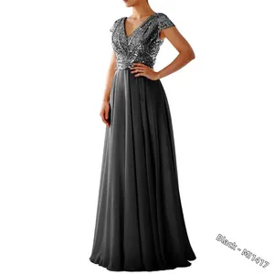 Detail of silver sequined V-neck bodice and flowing grey chiffon evening gown skirt