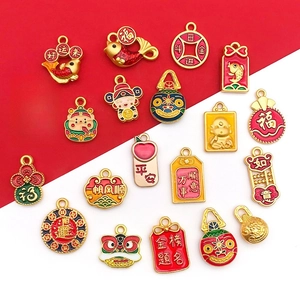 Collection of Chinese New Year enamel charms with lucky symbols and golden sand finish