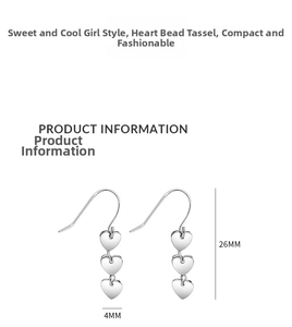 Detailed macro view showing the 26mm silver heart bead tassel earring dimensions