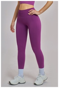 Detail of high-waist seamless purple yoga leggings with ribbed tummy control texture