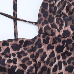 Detail of leopard print summer dress showing stitching and backless spaghetti strap