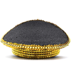 Close-up of bohemian captain hat featuring black sequins and golden metallic studs decoration