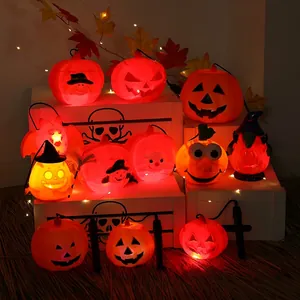 Halloween pumpkin lantern set with LED lights on wooden crate and autumn leaves decor