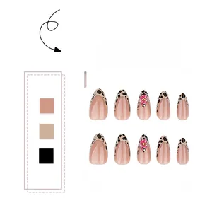 Detail of almond fake nails with leopard French tips, 3D flowers and rhinestones