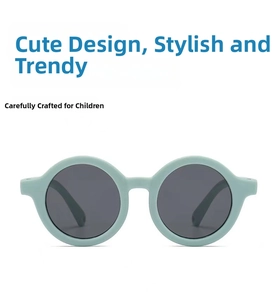 Detail view of round mint green soft silicone frame sunglasses for babies and kids