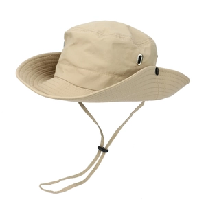Detail view of beige outdoor hat with metal eyelets, chin cord, and wide brim